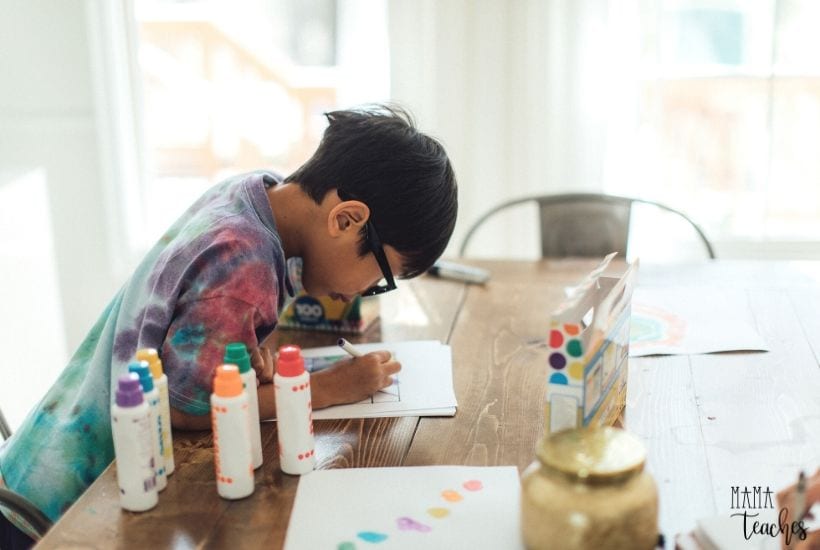 A child working on a math project using paints and markers is a great example of how there doesn't have to be an unschooling vs homeschooling dynamic.